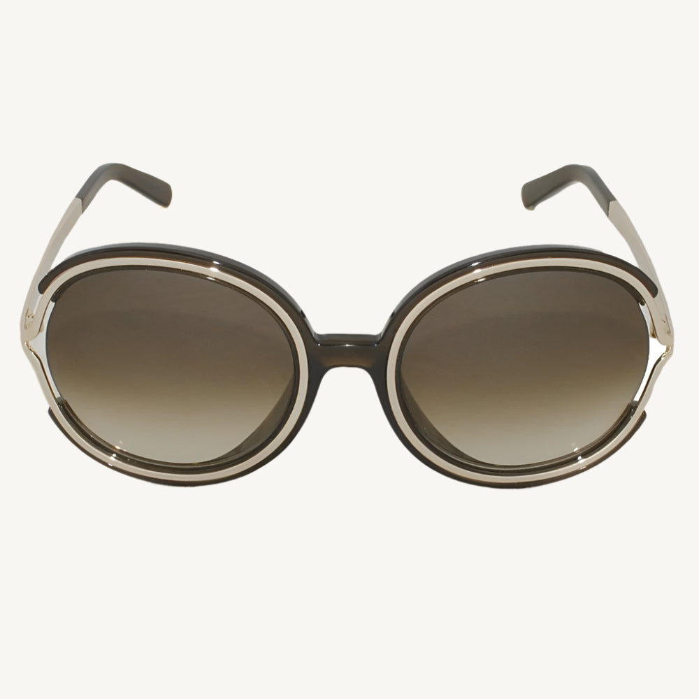 "Chloé women's sunglasses, model CE711SA-303, featuring soft khaki frame with silver accents and a chic, feminine silhouette"