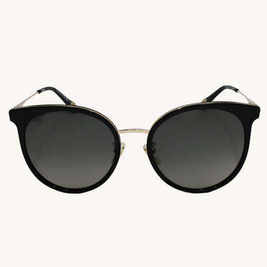 "Chloé women's black sunglasses, model CH0060SK-001, featuring a sleek, feminine silhouette with designer detailing"
