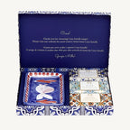 "Casa Amalfi Blue Maiolica Gift Box with two vegan body soaps—Blue Grotto Acqua Marine and Sunset in Procida Honey & Vanilla—and one Ischia Water Jasmine & Chamomile body scrub soap, plus a hand-painted ceramic soap dish from Vietri Sul Mare, all inspired by the Amalfi Coast and beautifully presented in a blue maiolica design."