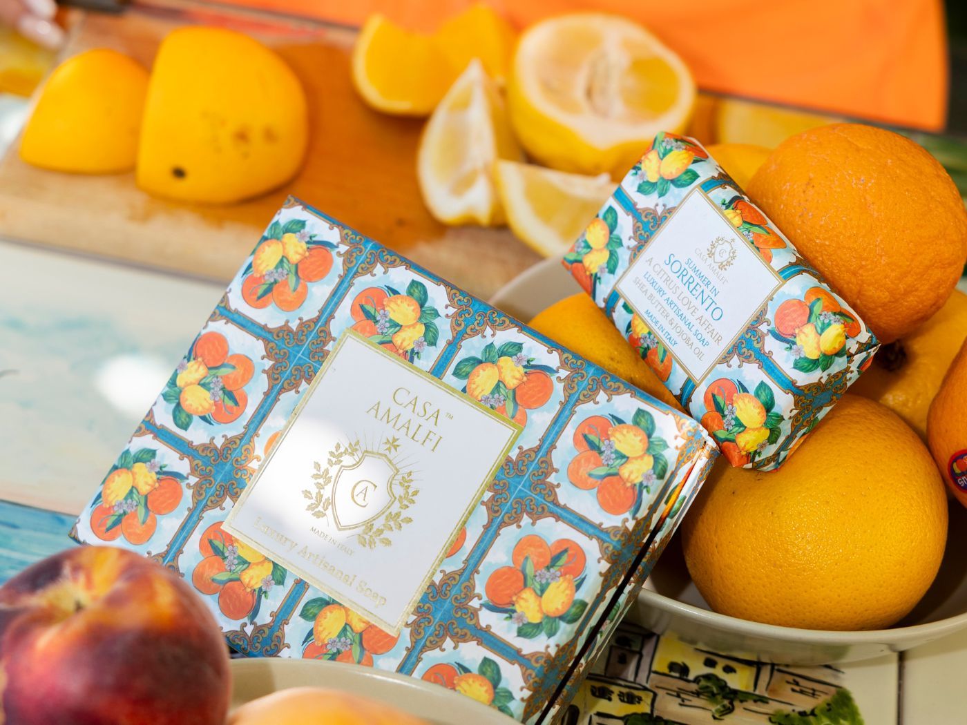 "Casa Amalfi Summer in Sorrento Gift Box featuring a 150g vegan orange, lemon & spices soap and a hand-painted ceramic soap dish from Vietri Sul Mare, inspired by the Amalfi Coast and presented in a glossy maiolica design."