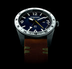 Watch with a dark blue face and brown strap on a black background