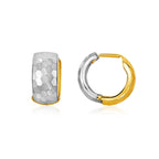 A pair of 14k two-tone gold hoop earrings with a diamond cut texture in white gold and a polished finish in yellow gold, featuring a snap lock closure.
