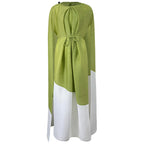 Green and white dress with long sleeves on a white background
