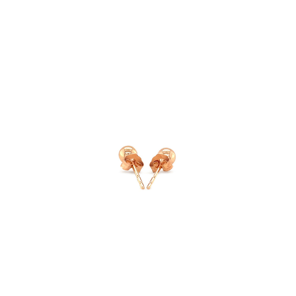 "14k rose gold stud earrings with shiny, globe-like design"