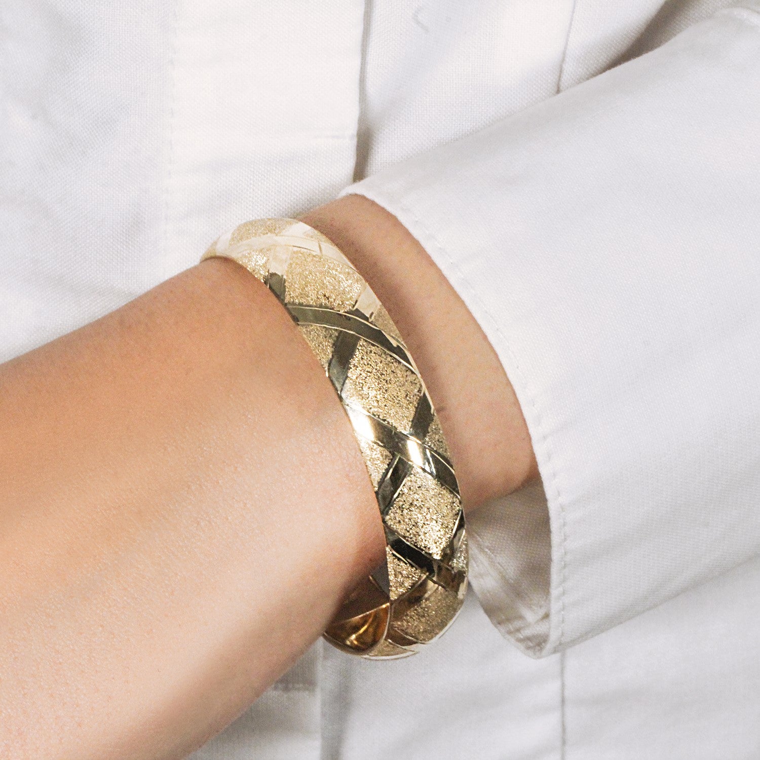 10k yellow gold thick bangle featuring polished strip borders and textured diamond-shaped details, available in 7-inch and 8-inch sizes — bold and stylish design.
