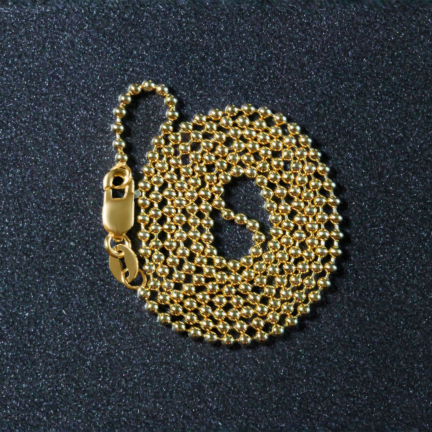 "14k yellow gold non-diamond cut bead chain, 1.5mm in width."