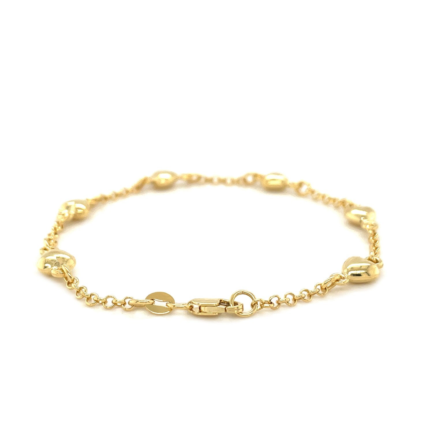 "14k yellow gold rolo chain bracelet with polished puffed heart stations, available in 6 or 7 inches, secured with a lobster clasp."