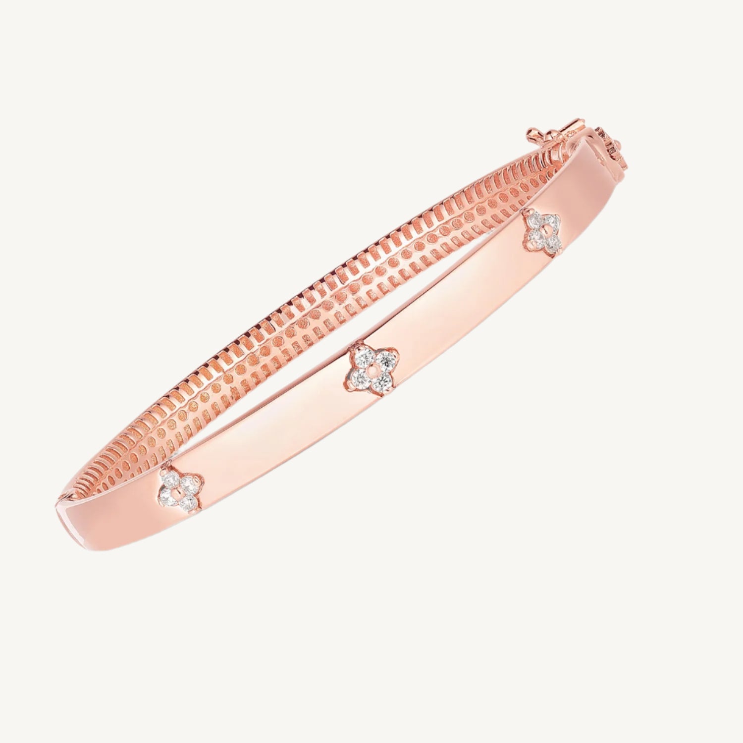"Elegant 14k rose gold trilogy diamond bangle with high polish finish, designed for everyday wear."