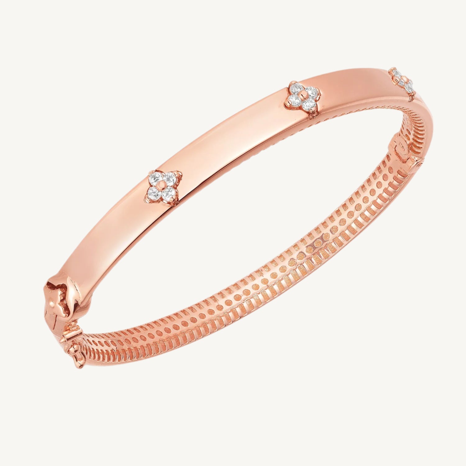 "Elegant 14k rose gold trilogy diamond bangle with high polish finish, designed for everyday wear."