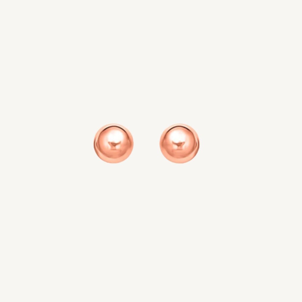 14k rose tone gold stud earrings with a classic spherical design and shiny polished finish.