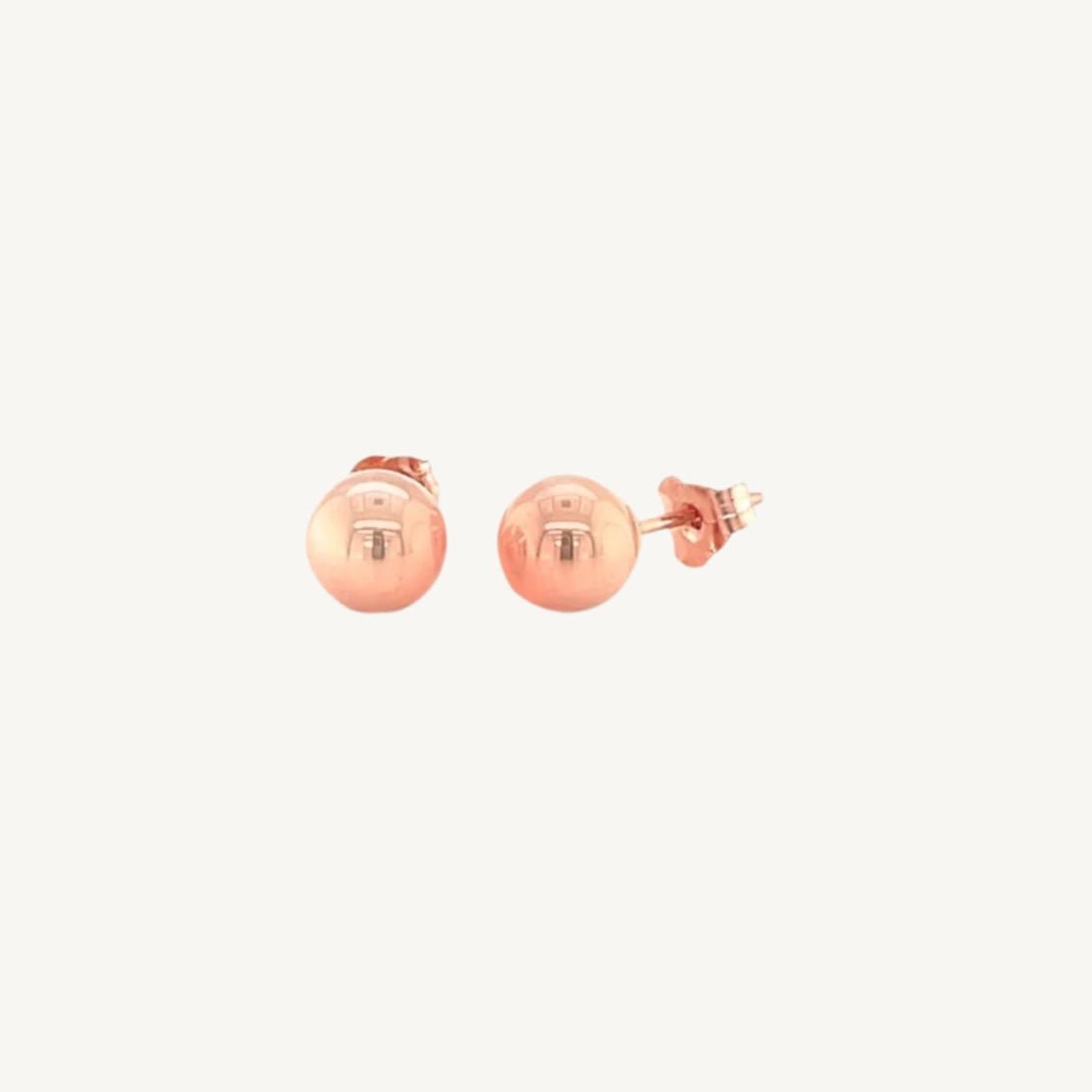 14k rose tone gold stud earrings with a classic spherical design and shiny polished finish.