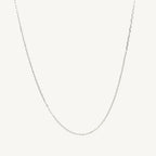 10k white gold diamond cut cable link chain with 0.87mm width, displayed on a neutral background.