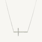 Elegant 7-inch bracelet featuring a classic cross design with sparkling cubic zirconia stones and a lobster clasp closure.