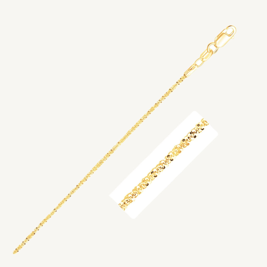 "Delicate 10k yellow gold sparkle anklet, 1.5 mm wide, with a shimmering finish that catches the light beautifully."