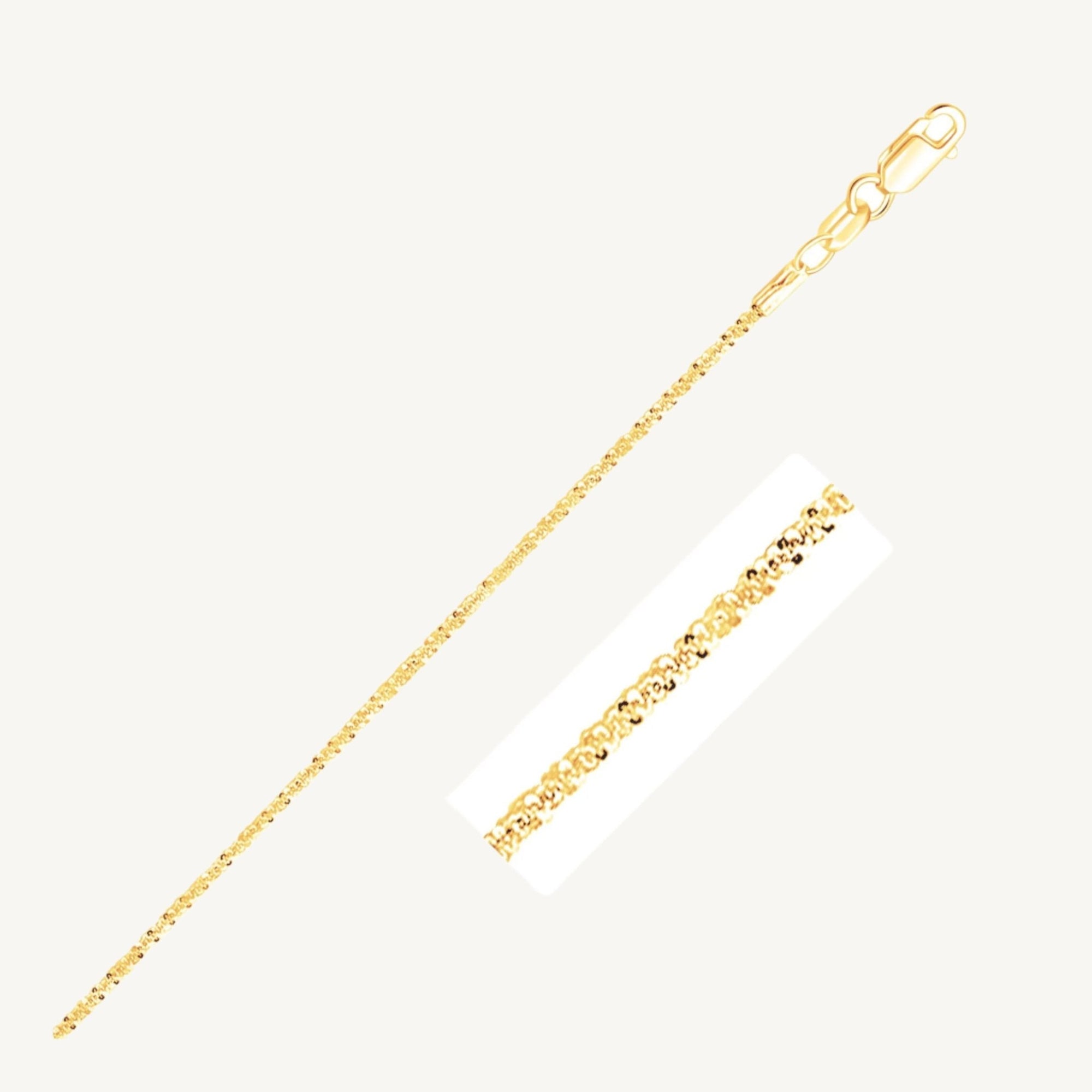 "Delicate 10k yellow gold sparkle anklet, 1.5 mm wide, with a shimmering finish that catches the light beautifully."