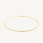 "Delicate 10k yellow gold sparkle anklet, 1.5 mm wide, with a shimmering finish that catches the light beautifully."