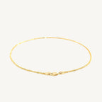 "Delicate 10k yellow gold sparkle anklet, 1.5 mm wide, with a shimmering finish that catches the light beautifully."