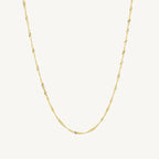 "Elegant 10k yellow gold Singapore chain, 1.50 mm wide, with a delicate twisted design and polished finish."