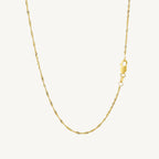 "Elegant 10k yellow gold Singapore chain, 1.50 mm wide, with a delicate twisted design and polished finish."