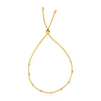 14k tri-color gold lariat bracelet with 5.00 mm textured bead stations in yellow, white, and rose gold.