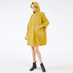 Person wearing a yellow raincoat on a white background