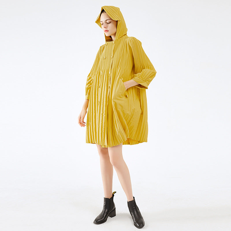 Person wearing a yellow raincoat on a white background