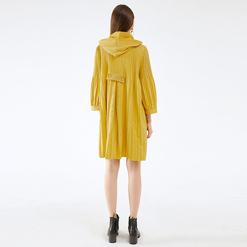 Person wearing a yellow raincoat on a white background