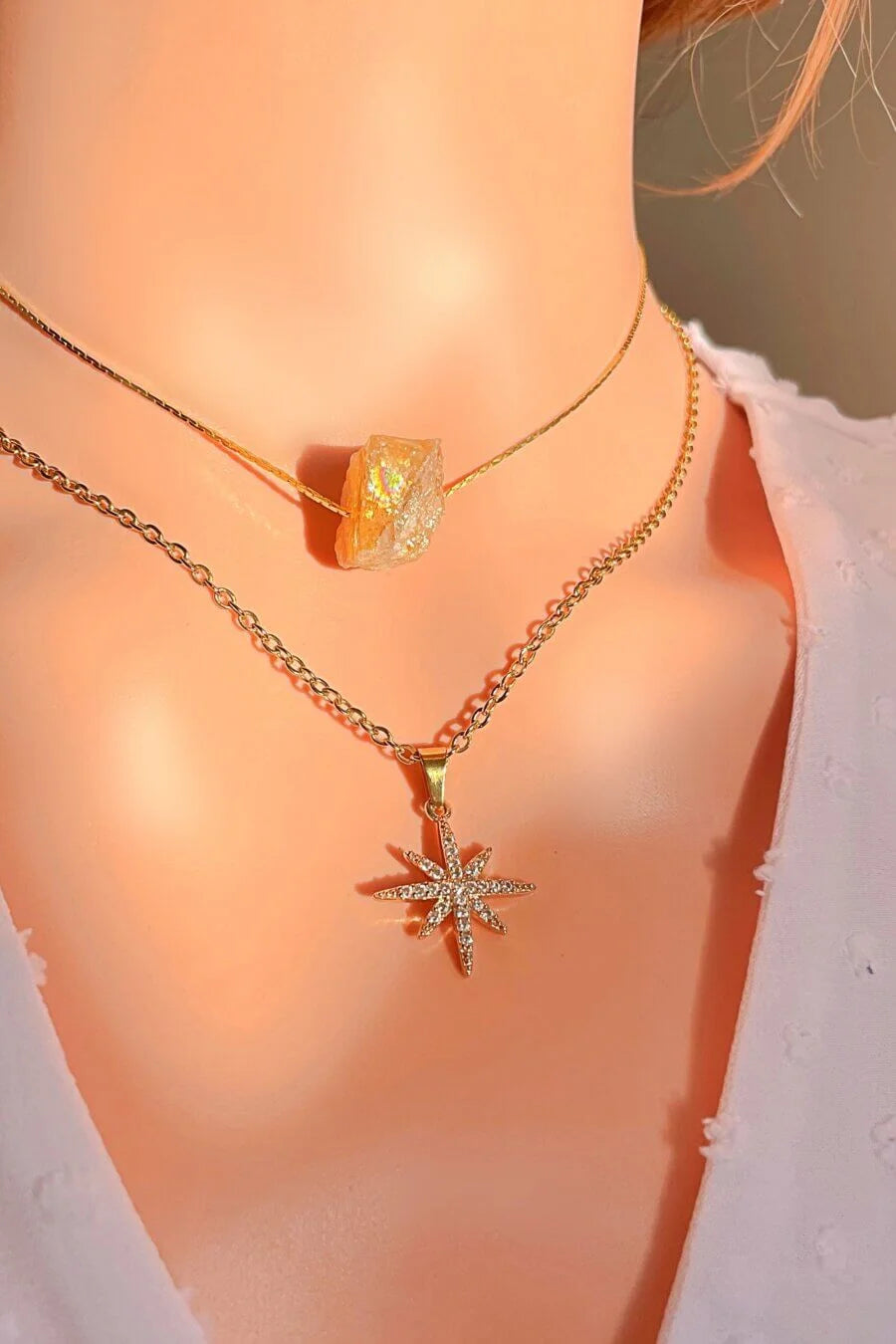 Necklace with a star-shaped pendant on a mannequin