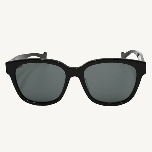 "Gucci unisex black sunglasses, model GG1430SK-001, featuring sleek designer style and iconic branding"