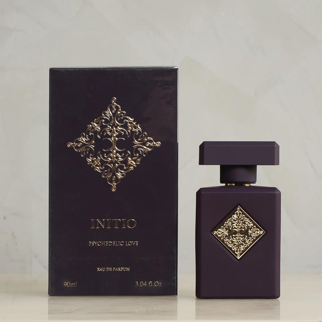 "Initio Parfums Privés Psychedelic Love 3.04 oz Eau de Parfum spray – seductive floral-oriental fragrance in a sleek matte purple bottle."