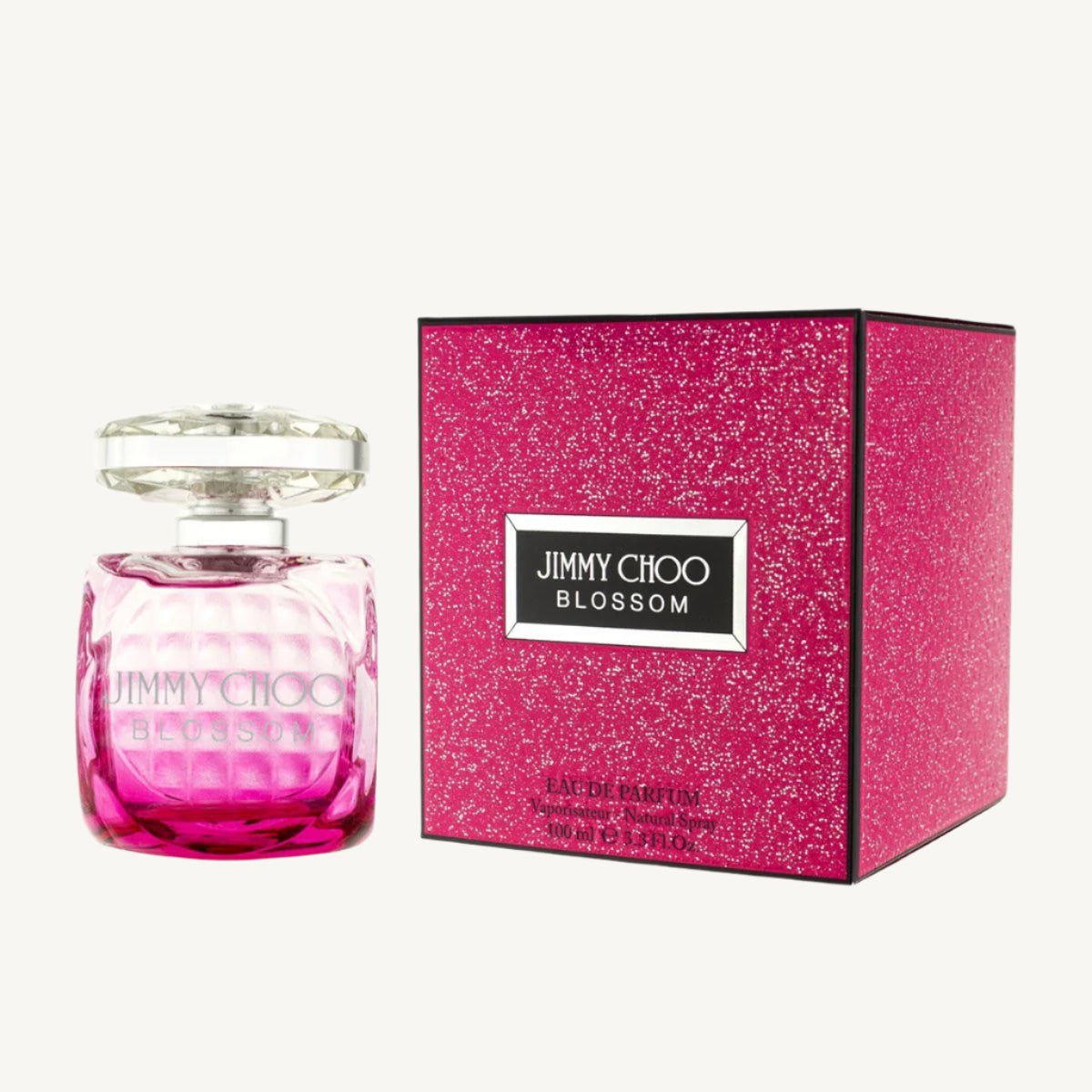 "Jimmy Choo Blossom 3.4 oz Eau de Parfum spray for women – fruity and floral fragrance in a vibrant pink bottle."
