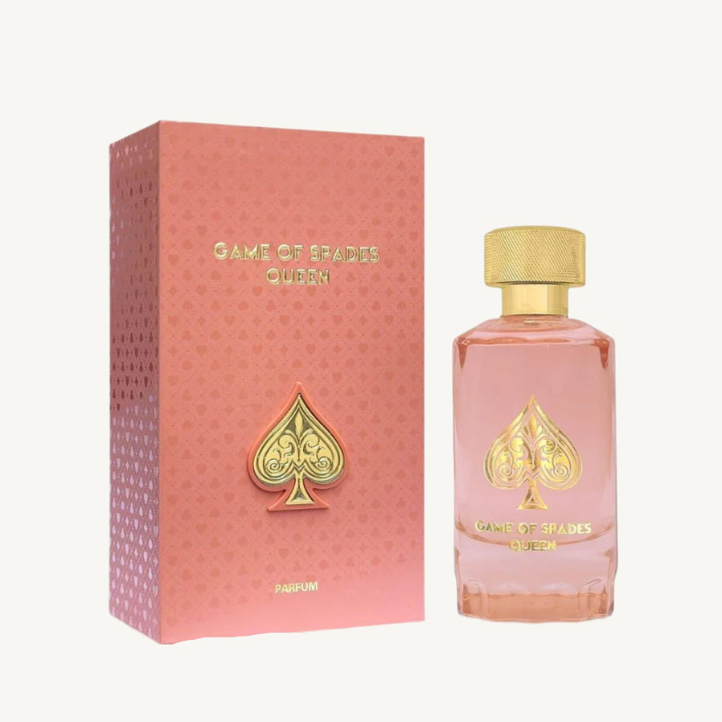 "Jo Milano Paris Game of Spades Queen 3.4 oz Parfum Spray – a luxurious pink-hued glass bottle adorned with a gold-toned cap and an embossed spade emblem, reflecting elegance and sophistication."