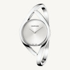 Stylish ladies’ silver-tone watch by Calvin Klein with a polished stainless steel case and strap, silver dial, slim profile, and quartz movement with 3 bar water resistance.