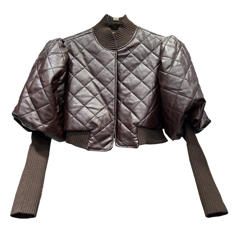 Quilted jacket with ribbed sleeves on a white background