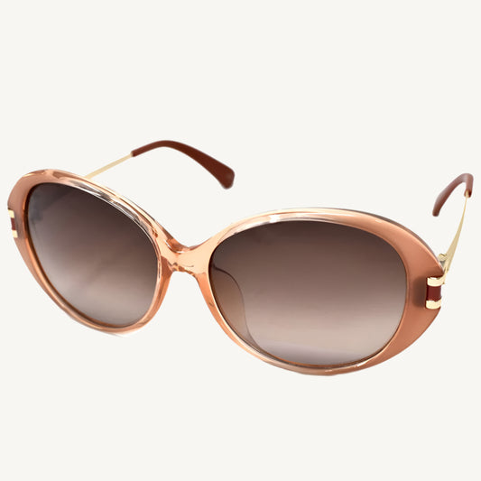 "Longchamp women's sunglasses, model LO610SA-749, in peach brick with soft cat-eye frame and refined Parisian elegance"