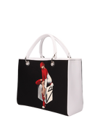 Hand-painted handbag with artwork on both front and back, red cotton logoed interior featuring four functional pockets, nickel-colored hooks and internal zip, double white leather handle, and a matching hand-painted leather and canvas shoulder strap reflecting the theme of the main painting, secured with a magnetic button closure.