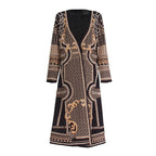 Decorative long-sleeve dress with intricate patterns on a white background