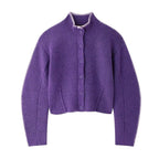 Purple cardigan with button details on a white background