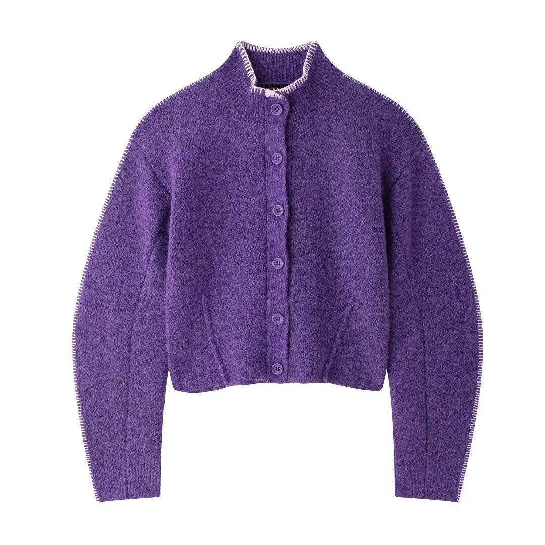 Purple cardigan with button details on a white background