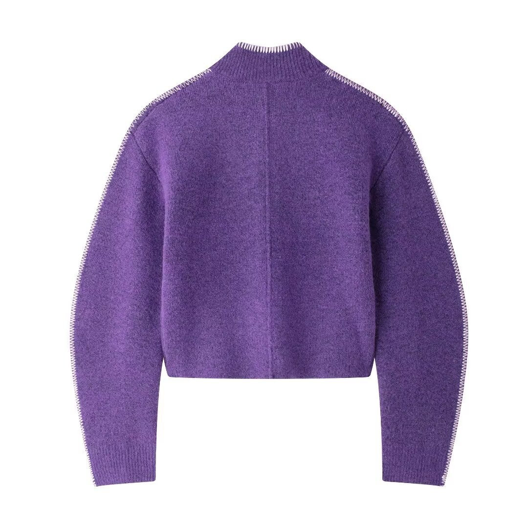 Purple sweater on a white background
