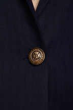 Navy peak-lapel single-breasted blazer — tailored and sophisticated, designed with sharp peak lapels and a streamlined silhouette, perfect for professional and smart-casual occasions.