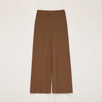 Brown wide-leg pants on a light beige background