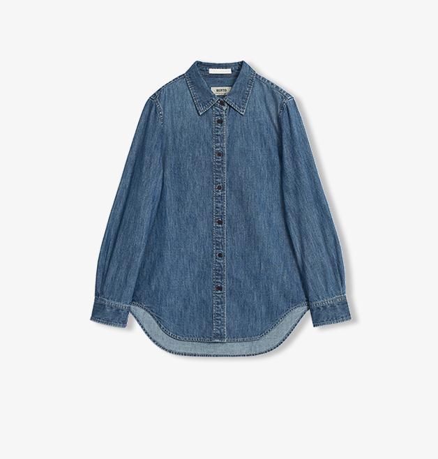 Blue denim shirt on a white background