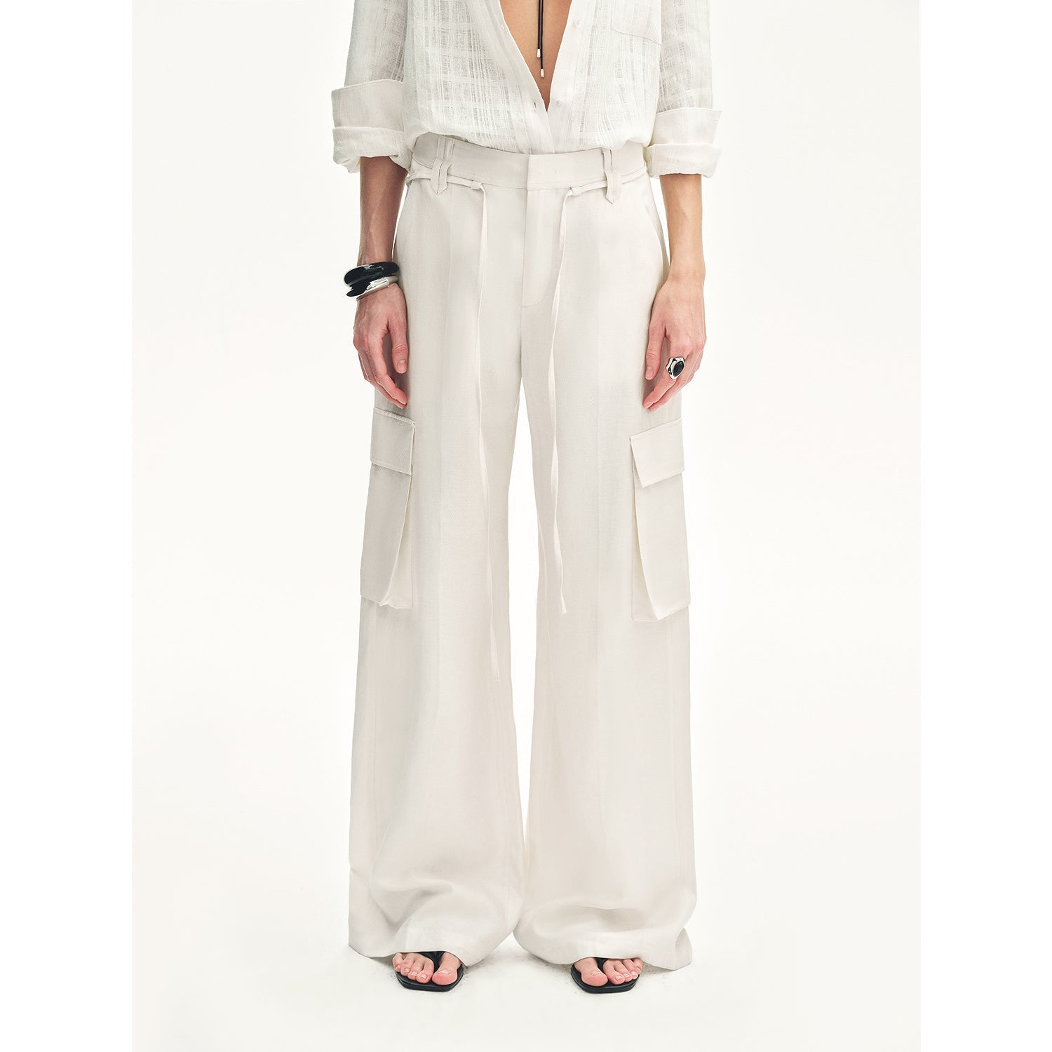 White outfit with wide-leg pants on a white background