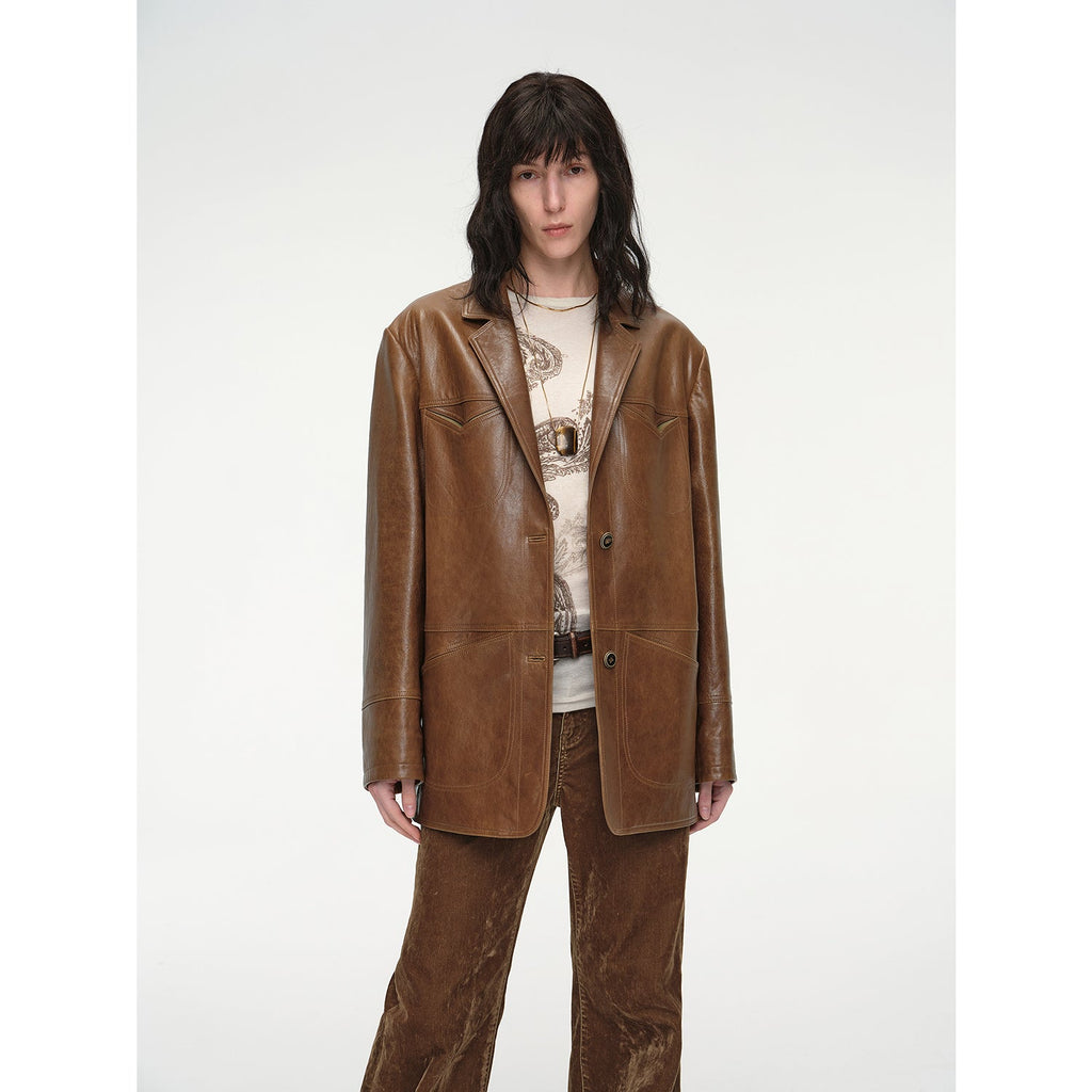 Person wearing a brown leather suit on a white background