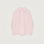 Pink shirt on a light gray background