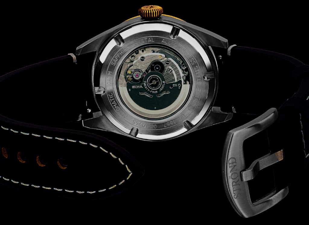 Watch with open face revealing mechanical components on a black background