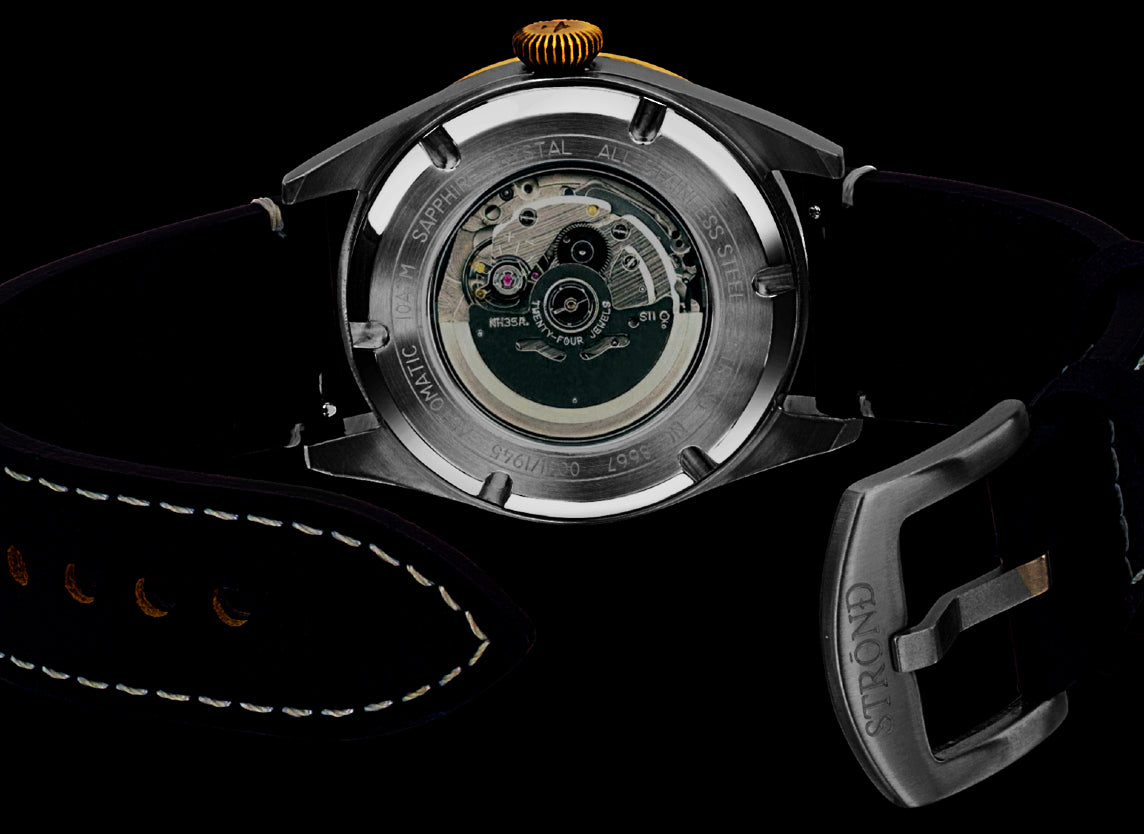 Watch with open face revealing mechanical components on a black background
