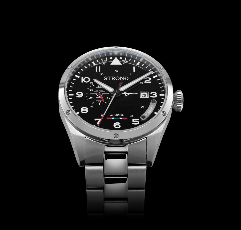 Silver watch with black dial on a black background