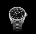 Silver watch with black dial on a black background